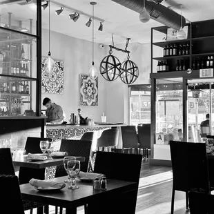 a black and white photo of a restaurant