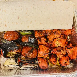 Halal Chicken skewers, veggie mix skewers and complimentary lavash!