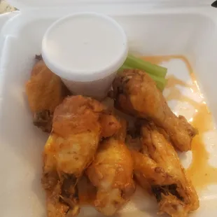 chicken wings in a styrofoam container