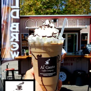 a hand holding a cup of coffee