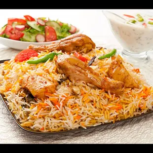 Chicken Biryani Bliss: Fragrant basmati rice layered with aromatic spices and succulent chicken, creating an exquisite one-pot masterpiece.