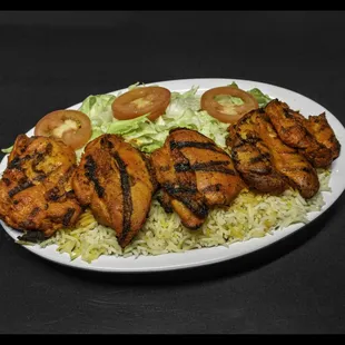 Chicken Boti Perfection: Succulent chunks of marinated chicken, skewered and grilled to smoky perfection, delivering a burst of flavor in e