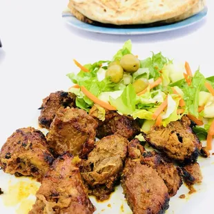 Lamb Kabab. $8.99. Seasoned. Tendered. And not gamey. It comes with salad and olives as you see in the pic.