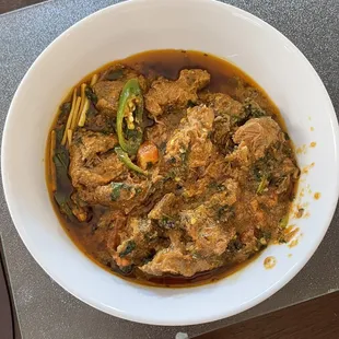 25. Lamb Karahi.  Spicy thick sauce and meaty.