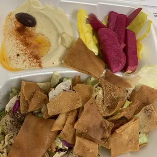 Free fattoush salad and hummus side that comes with combo trays...