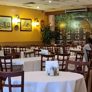 a dining area with tables and chairs