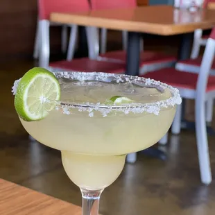 a margarita with a lime slice on the rim