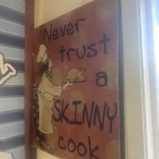 a sign that says never trust a skinny cook