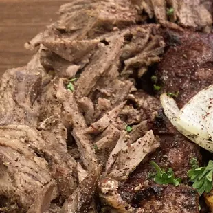 a plate of meat and vegetables