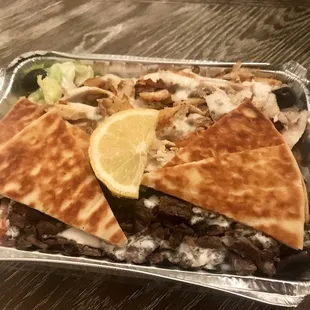 Combo chicken and beef shawarma platter over rice and salad -- decent $8.50 value.