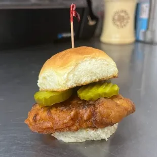 a chicken sandwich with pickles