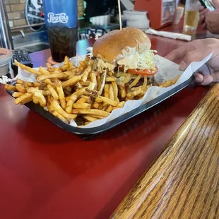Burger with haystack onions, lettuce, tomato, pepper jack &amp; special sauce.  Side of fries.