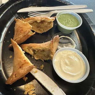 Samosas were amazing!! We cut them in half to cool before we ate them. Green sauce was on point!
