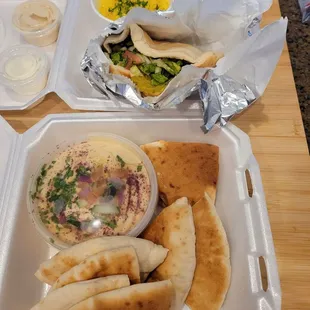 Falafel pita pocket with side of rice $ 9.79 and pita chips w hummus $7.69