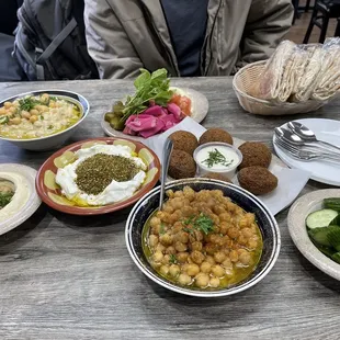 Hummus, Mosabaha, Balila, Labneh with Zaatar, falafel, pita