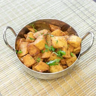 Batata Harra, spicy sautéed cubes of potatoes mixed with lemon and a fresh coriander mix