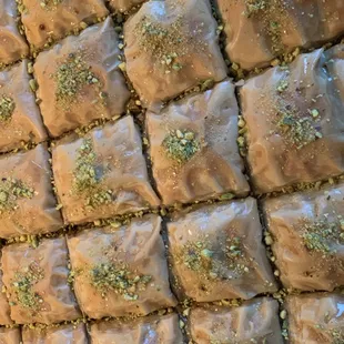 a close up of a tray of baklaa