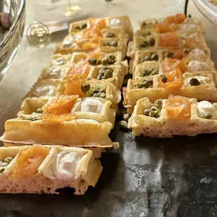 This was a waffle with smoked salmon, capers, and cheese.