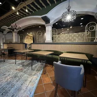 a dining area with tables and chairs