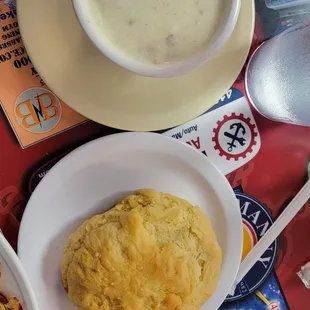 a bowl of soup and a plate of biscuits
