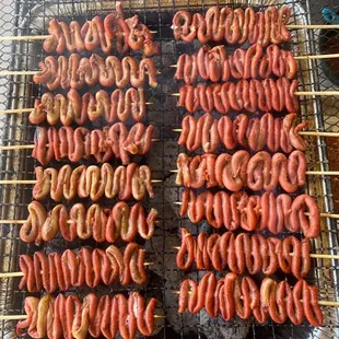 a bunch of sausages on a grill