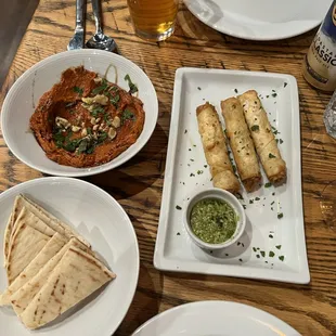 Warm pita bread, cigar bourek with a tasty side sauce, muhammara (so creamy).