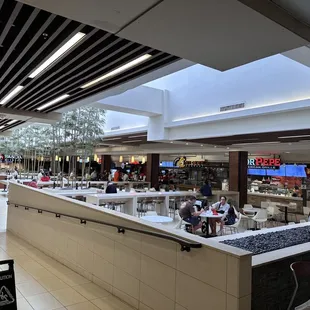Going down the ramp with stroller in food court
