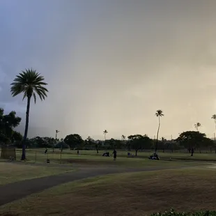 Cloud burst; sunrise over the putting green