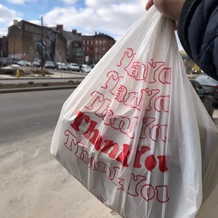 a person holding a plastic bag