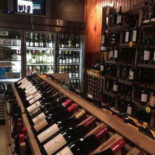 a large selection of wine bottles