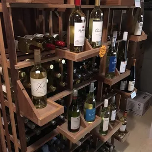 a wine rack full of wine bottles