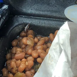 a bag of baked beans in a frying pan