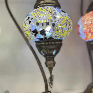 a closeup of a mosaic lamp