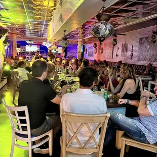 a group of people sitting at a table