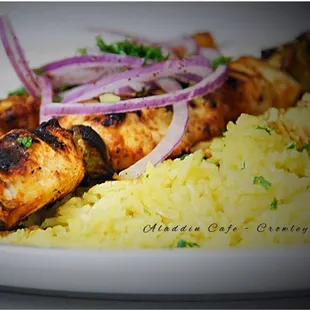 a plate of chicken and rice