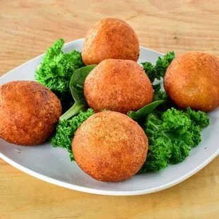a plate of deep fried meatballs