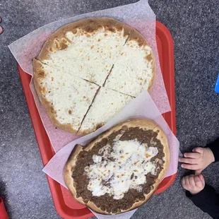 two pizzas on a tray