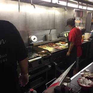 Cooks are busy grilling up the orders.