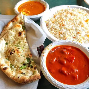 From the top going clockwise)l, Butter Chicken, Biryani Rice, Chicken Tikka Masala and the star of the show, Garlic Naan Bread
