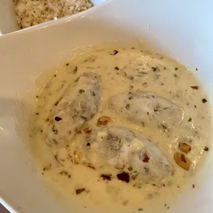 Kibbi Bi Laban - Cooked kibbi balls in yogurt sauce w/ sautéed cilantro &amp; garlic