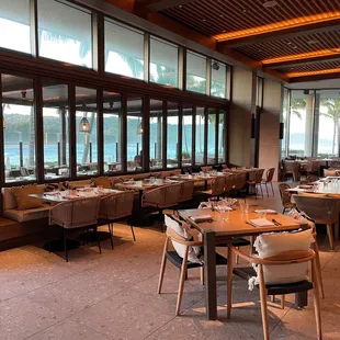 a restaurant with a view of the ocean