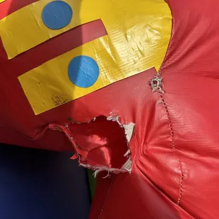 Holes in the horse inside the bounce house
