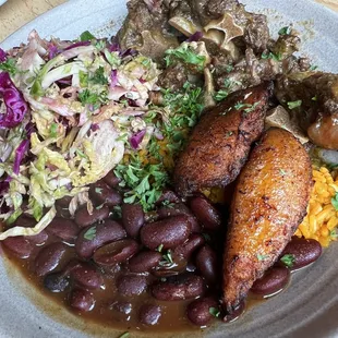 Braised Oxtail Rice Bowl with cabbage slaw, stewed red beans, steamed yellow rice and sweet plantains