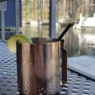 a copper mug with a lime wedge