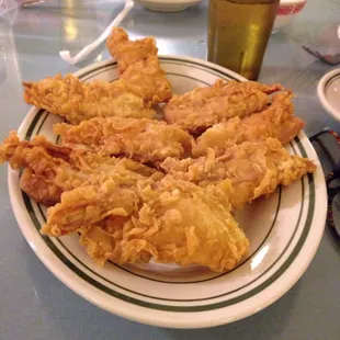 Fried shrimp with sweet and sour sauce on the side.