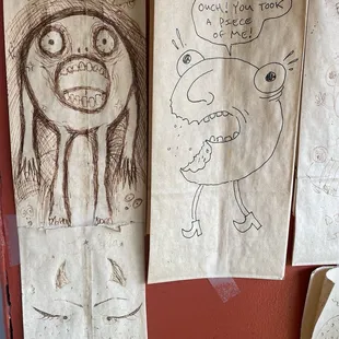 Cute bagel drawings on brown bags on the wall