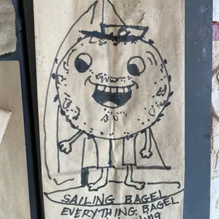Cute bagel drawings on brown bags on the wall