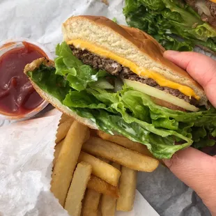 Cheeseburger with extra lettuce, no mustard, cut in half.  Combo with regular fries and a drink.  Delicious!