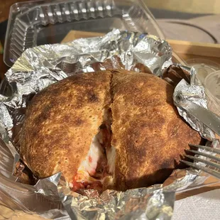 Pizza calzone with mushrooms and pepperoni