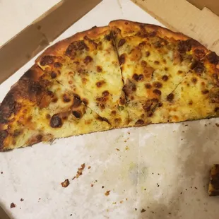 a half eaten pizza in a box